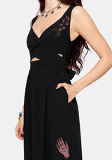 Black dress with embroidered details on a white background