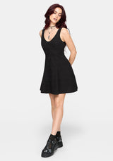 Woman wearing a black sleeveless dress on a white background