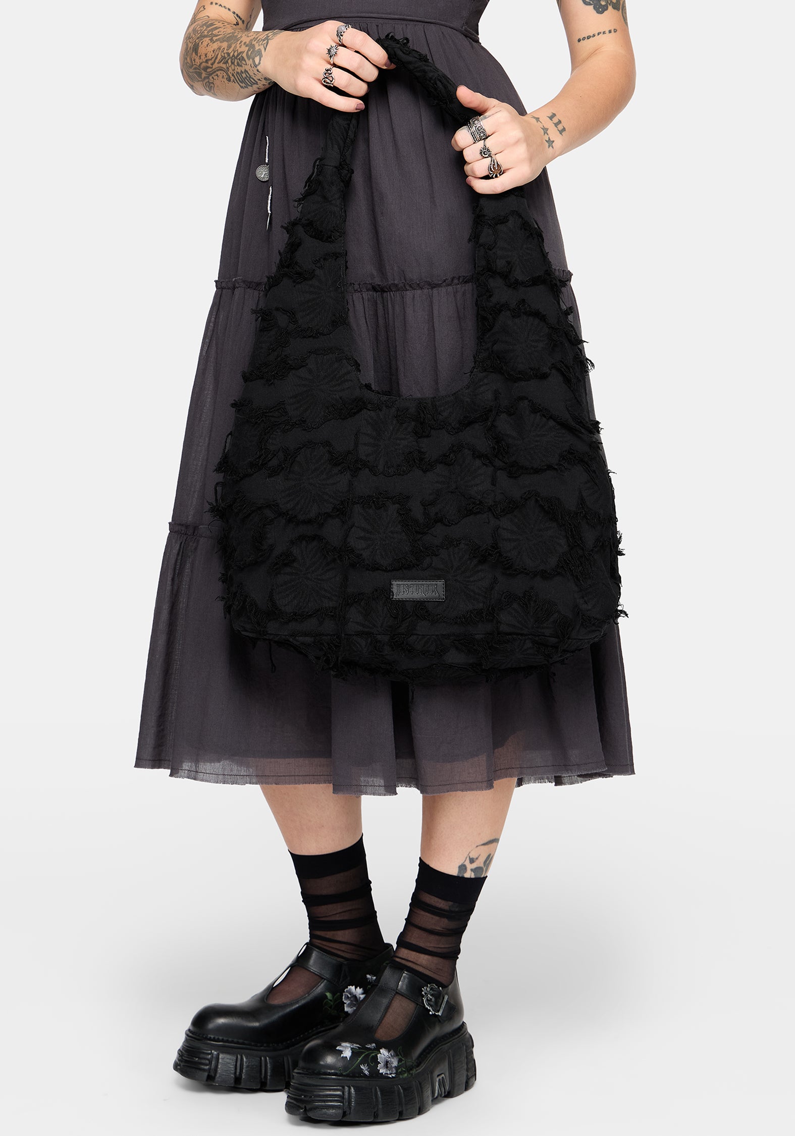 Black textured handbag on a white background