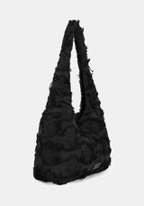 Black textured handbag on a white background
