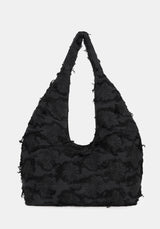 Black textured handbag on a white background