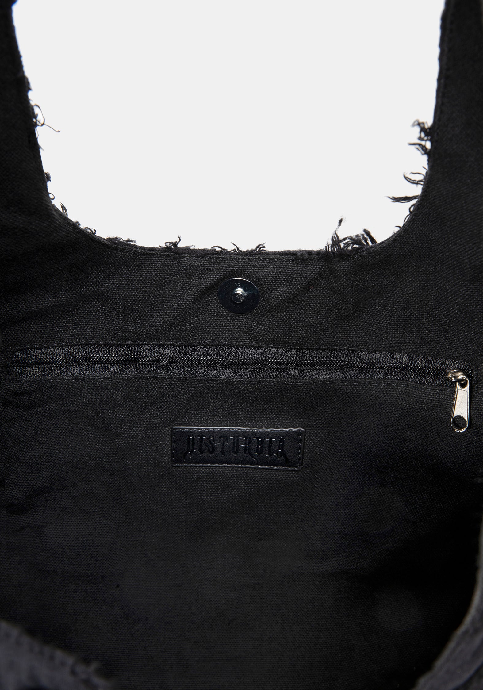 Close-up of a black bag with a brand logo on a white background
