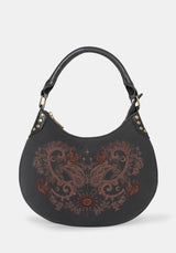 Black handbag with intricate designs on a white background
