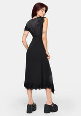 A woman modeling a black midi dress with lace detailing on the shoulders and hem, shown from the back against a light gray studio background.