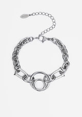 A silver-toned chain bracelet featuring a central interlocking circular link motif and an adjustable extender chain with a branded tag, shown on a light gray background.