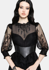 A model wearing a black gothic-style dress with sheer lace puff sleeves, a sheer mesh high neck with floral embroidery, and a structured black corset waist.
